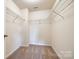 Spacious walk-in closet with multiple wire shelves, maximizing storage and organization within the bedroom suite at 609 Kahana River Rd, Fort Mill, SC 29715