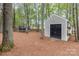 Private backyard with trees, a storage shed, and space for outdoor recreation at 8013 Sheckler Ln, Matthews, NC 28104