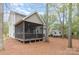 Expansive backyard featuring a screened porch and plenty of space for outdoor activities at 8013 Sheckler Ln, Matthews, NC 28104