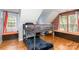 Bedroom with a bunk bed, a hardwood floor, and brick accent wall at 8013 Sheckler Ln, Matthews, NC 28104