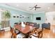Open-concept dining area with hardwood floors and plenty of natural light at 8013 Sheckler Ln, Matthews, NC 28104