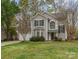 Charming two-story home with well-manicured lawn and attached two car garage at 8013 Sheckler Ln, Matthews, NC 28104