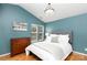 Bright main bedroom with hardwood floors, vaulted ceiling, and a cozy sitting area at 8013 Sheckler Ln, Matthews, NC 28104