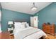 Tranquil main bedroom with a comfortable bed, side table, and ample natural light at 8013 Sheckler Ln, Matthews, NC 28104