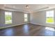 A bright bedroom with lots of natural light, plush carpet, and a tray ceiling at Tbd Boomer Ct # 10, Statesville, NC 28677