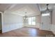 An open dining room features modern lighting, hardwood floors, and white wainscoting at Tbd Boomer Ct # 10, Statesville, NC 28677