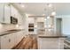 Modern kitchen showcasing custom cabinets, stainless steel appliances, granite countertops, and wood floors at Tbd Boomer Ct # 11, Statesville, NC 28677