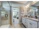 Stylish bathroom with tiled shower, double vanity, and views into main bedroom at Tbd Boomer Ct # 12, Statesville, NC 28677