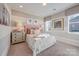 Cozy bedroom features unique striped walls, bedside tables with lamps, and neutral decor at Tbd Boomer Ct # 12, Statesville, NC 28677