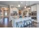 Bright kitchen with white cabinets, stainless steel appliances, and island with bar seating at Tbd Boomer Ct # 12, Statesville, NC 28677