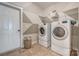 Laundry room with washer, dryer, tile floors, and shelving for storage at Tbd Boomer Ct # 12, Statesville, NC 28677
