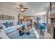 Open-concept living area featuring hardwood floors, a stone fireplace, and a view into the kitchen at Tbd Boomer Ct # 12, Statesville, NC 28677