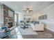 Spacious living room with a stone fireplace, modern decor, and plenty of natural light at Tbd Boomer Ct # 12, Statesville, NC 28677
