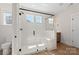 Modern bathroom featuring a glass-enclosed shower with a built-in bench and a sleek, minimalist design at Tbd Boomer Ct # 13, Statesville, NC 28677