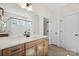 Bright bathroom featuring modern vanity, mirror, and shower with glass door at Tbd Boomer Ct # 13, Statesville, NC 28677
