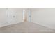 Bright, carpeted bedroom with neutral walls, features two doors and ample space, perfect for relaxation at Tbd Boomer Ct # 13, Statesville, NC 28677