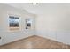 Bright bedroom with two windows, neutral walls, and hardwood floors at Tbd Boomer Ct # 13, Statesville, NC 28677