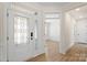 Inviting entryway with decorative glass door, hardwood floors, and modern finishes at Tbd Boomer Ct # 13, Statesville, NC 28677