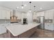 Modern kitchen featuring white cabinets, stainless steel appliances, and a large island at Tbd Boomer Ct # 13, Statesville, NC 28677