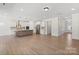 Spacious open-concept living room featuring hardwood floors and natural light next to the kitchen at Tbd Boomer Ct # 13, Statesville, NC 28677