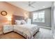 Bedroom featuring a large window, plush white bedding, and a padded headboard, complete with a carpeted floor at Tbd Boomer Ct # 14, Statesville, NC 28677