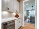 Butler's pantry featuring white cabinets, a wine rack, and an under-counter refrigerator at Tbd Boomer Ct # 14, Statesville, NC 28677