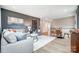 Open concept living room with gray walls, a ceiling fan, light-colored wood flooring, and modern decor at Tbd Boomer Ct # 14, Statesville, NC 28677