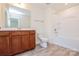 Bright bathroom with wood vanity and modern fixtures, featuring tub and shower at Tbd Boomer Ct # 8, Statesville, NC 28677