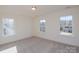 Bedroom filled with natural light from three windows, featuring neutral carpeting at Tbd Boomer Ct # 8, Statesville, NC 28677