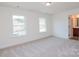 Bright bedroom with two windows and view to bath with lovely wood vanity at Tbd Boomer Ct # 8, Statesville, NC 28677