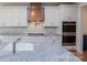 Bright kitchen with granite counters, white cabinets, stainless steel appliances, and a stylish tile backsplash at Tbd Boomer Ct # 8, Statesville, NC 28677