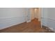 Office or flex space with hardwood flooring, decorative trim and glass French doors at Tbd Boomer Ct # 8, Statesville, NC 28677