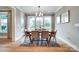Dining room featuring hardwood floors, large windows overlooking the backyard, and stylish lighting fixture at Tbd Boomer Ct # 9, Statesville, NC 28677