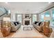 Living room with a fireplace, hardwood floors, neutral paint, white trim and ample natural light at Tbd Boomer Ct # 9, Statesville, NC 28677