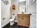 Powder room with black hexagon tile, modern vanity, toilet, and white walls at Tbd Boomer Ct # 9, Statesville, NC 28677