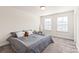 Inviting bedroom with natural light, neutral paint, and comfy carpet at 1043 Kalli Dr, Matthews, NC 28104