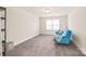 Neutral bedroom featuring comfortable carpet, closet with shelving, and natural light at 1043 Kalli Dr, Matthews, NC 28104