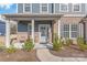 Inviting front porch with cozy seating area, perfect for enjoying the outdoors at this lovely home at 1043 Kalli Dr, Matthews, NC 28104