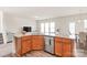 Modern kitchen with granite countertops, stainless steel appliances, and sleek wood cabinetry, great for cooking at 1043 Kalli Dr, Matthews, NC 28104