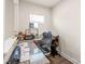 Functional home office space with a granite desk, natural light, and comfortable seating at 1043 Kalli Dr, Matthews, NC 28104