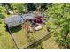 A serene backyard featuring a patio, flowers, fenced yard and storage buildings at 1060 Sierra Rd, York, SC 29745