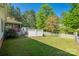 Expansive backyard featuring a well maintained lawn, fence, and mature trees at 1060 Sierra Rd, York, SC 29745