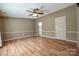 Bright bedroom featuring a ceiling fan, neutral colors, and durable wood-look flooring throughout at 1060 Sierra Rd, York, SC 29745