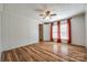Bright bedroom featuring a ceiling fan, two windows, and access to a walk-in closet for easy storage at 1060 Sierra Rd, York, SC 29745