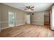 Spacious bedroom with a ceiling fan, light colored walls, and wood-look flooring for comfort at 1060 Sierra Rd, York, SC 29745