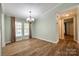 Dining room with hardwood floors, neutral walls, and large windows, ideal for Gathering meals at 1060 Sierra Rd, York, SC 29745
