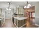 Kitchen open to dining and living areas, featuring an island and ample cabinet space, perfect for entertaining at 1060 Sierra Rd, York, SC 29745