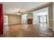 Open-concept living space with hardwood floors, fireplace, and access to kitchen and dining area at 1060 Sierra Rd, York, SC 29745