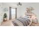 Cozy bedroom with a window, decor shelving and a stylish ceiling fan at 111 Pine Grove Church Rd, Concord, NC 28025