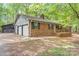A well-maintained brick home with green shutters and a two-car garage, offering classic curb appeal at 111 Pine Grove Church Rd, Concord, NC 28025